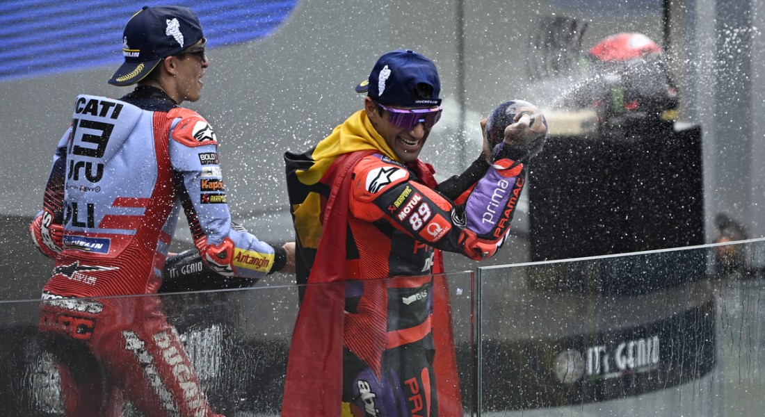 Race winner Prima Pramac Racing's Spanish rider Jorge Martin (R) and second-placed Gresini Racing MotoGP's Spanish rider Marc Marquez celebrate on the podium of the French MotoGP Grand Prix race at the Bugatti circuit in Le Mans, northwestern France, on May 12, 2024. (Photo by JULIEN DE ROSA / AFP)