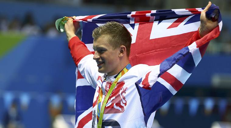 2016 Rio Olympics - Swimming - Victory Ceremony - Men's 100m Breaststroke Victory Ceremony - Olympic Aquatics Stadium - Rio de Janeiro, Brazil - 07/08/2016. Adam Peaty (GBR) of United Kingdom poses with the Union Jack flag after winning the gold.    REUTERS/Michael Dalder FOR EDITORIAL USE ONLY. NOT FOR SALE FOR MARKETING OR ADVERTISING CAMPAIGNS.