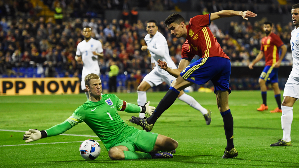 ALICANTE, SPAIN - NOVEMBER 13:  Marc Bartra of Spain is foiled by Joe Hart of England during the international friendly match between Spain and England at Jose Rico Perez Stadium on November 13, 2015 in Alicante, Spain.  (Photo by Mike Hewitt/Getty Images)