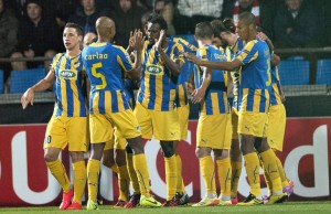 APOEL Nicosia of Cyprus' players celebrates a goal by Franco Vinicius during their Champions League play-off match against Aab Aalborg of Denmark at the Nordjyske Arena in Aalborg August 20, 2014. REUTERS/Henning Bagger/Scanpix Denmark (DENMARK - Tags: SPORT SOCCER) ATTENTION EDITORS - THIS PICTURE WAS PROVIDED BY A THIRD PARTY. FOR EDITORIAL USE ONLY. NOT FOR SALE FOR MARKETING OR ADVERTISING CAMPAIGNS. THIS PICTURE IS DISTRIBUTED EXACTLY AS RECEIVED BY REUTERS, AS A SERVICE TO CLIENTS. DENMARK OUT. NO COMMERCIAL OR EDITORIAL SALES IN DENMARK. NO COMMERCIAL SALES