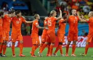 SALVADOR, BRAZIL - JULY 05: (L-R) Daley Blind, Stefan de Vrij, Klaas-Jan Huntelaar, Wesley Sneijder, Dirk Kuyt, Jeremain Lens, Georginio Wijnaldum and Ron Vlaar of the Netherlands congratulate Arjen Robben on his made penalty kick in a shootout during the 2014 FIFA World Cup Brazil Quarter Final match between the Netherlands and Costa Rica at Arena Fonte Nova on July 5, 2014 in Salvador, Brazil.  (Photo by Dean Mouhtaropoulos/Getty Images)