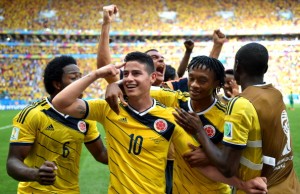 BRASILIA, BRAZIL - JUNE 19:  James Rodriguez of Colombia celebrates scoring his team's first goal with his teammates during the 2014 FIFA World Cup Brazil Group C match between Colombia and Cote D'Ivoire at Estadio Nacional on June 19, 2014 in Brasilia, Brazil.  (Photo by Stuart Franklin - FIFA/FIFA via Getty Images)