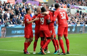 Liverpool's Roberto Firmino (second from left) celebrates scoring his side's first goal of the game with his team-mates during the Premier League match at the Liberty Stadium, Swansea.