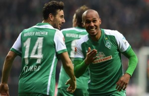 05 Mar 2016, Bremen, Germany --- Bremen's Theodor Gebre Selassie (R) celebrates his 3-1 goal with teammate Claudio Pizarro (L) during the German Bundesliga soccer match between Werder Bremen and Hannover 96 at the Weserstadion in Bremen, Germany, 05 March 2016. Photo: CARMEN JASPERSEN/dpa (EMBARGO CONDITIONS - ATTENTION: Due to the accreditation guidelines, the DFL only permits the publication and utilisation of up to 15 pictures per match on the internet and in online media during the match.) --- Image by ฉ Carmen Jaspersen/dpa/Corbis